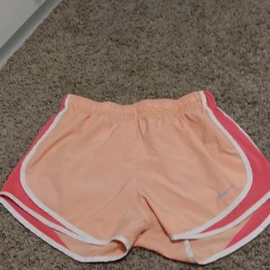 Coral and pink Nike shorts